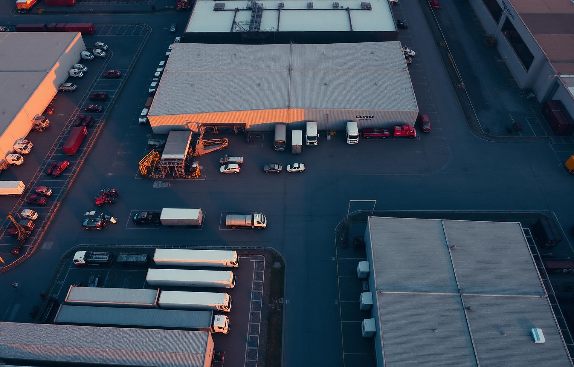 Aerial view of an industrial logistics facility at dawn
